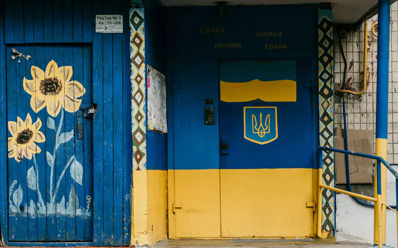 Blue and yellow Ukrainian flag color painted house