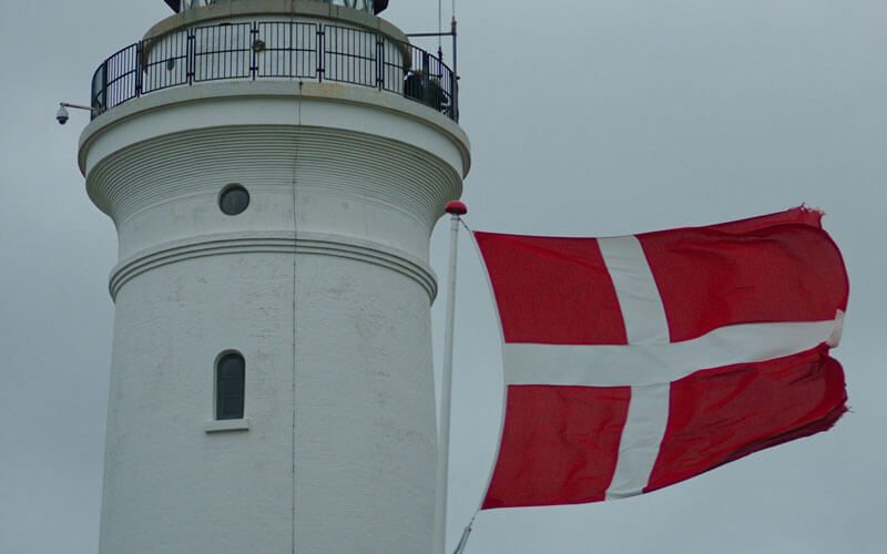 Denmark flag with the white cross at the light house