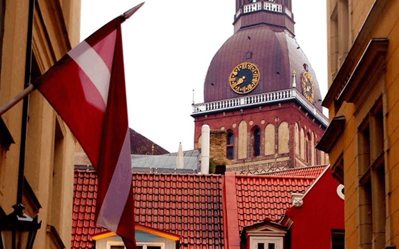 Flag of Austria infront of clock tower