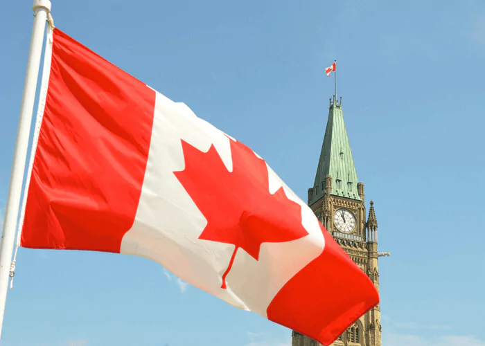 Flag of Canada infront of the clock tower