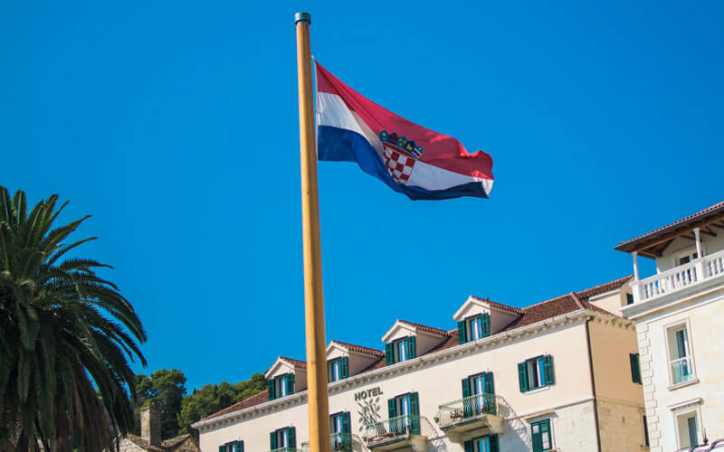 Flag of Croatia waving infront of the building