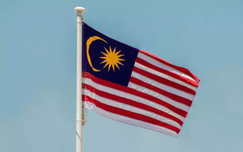 Flag of Malaysia fluttering in the breeze