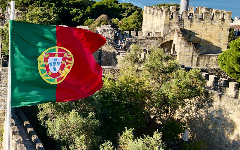 Flag of Portugal flying at the historical building