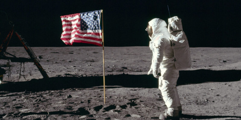 Flag on the moon with astronaut