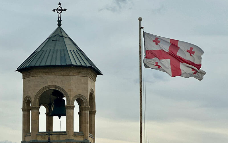 Georgian flag flying next to the church