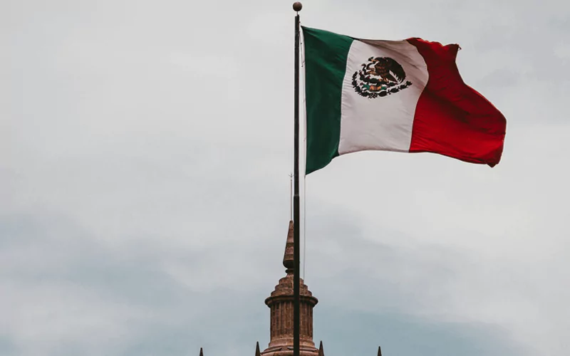 Green, white and red Mexican flag on the building