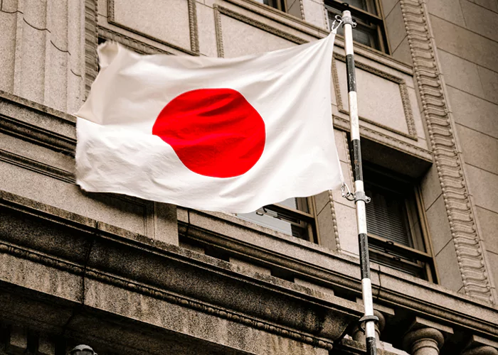Japanese flag flying infront of the building
