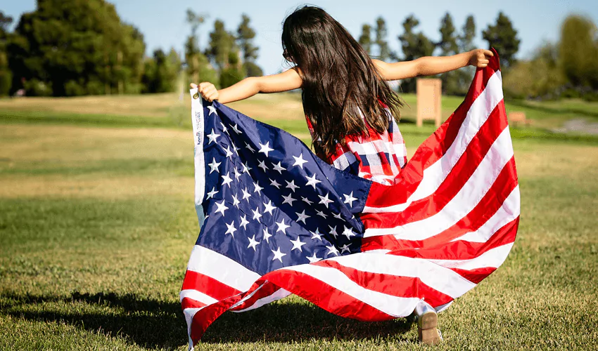 Little girl holding American flag