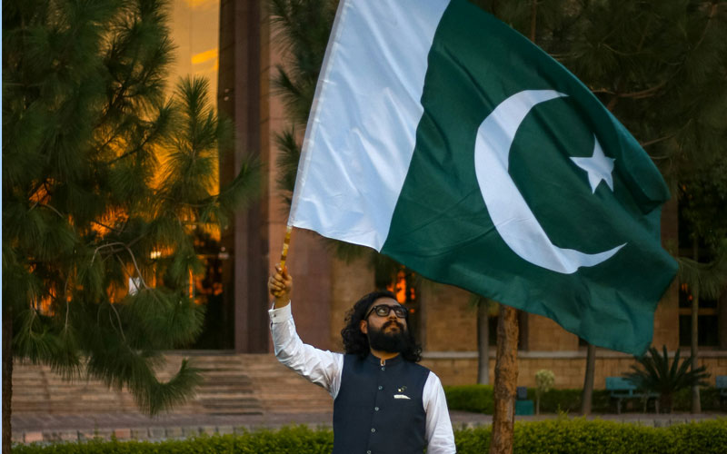 Man waving Pakistani flag