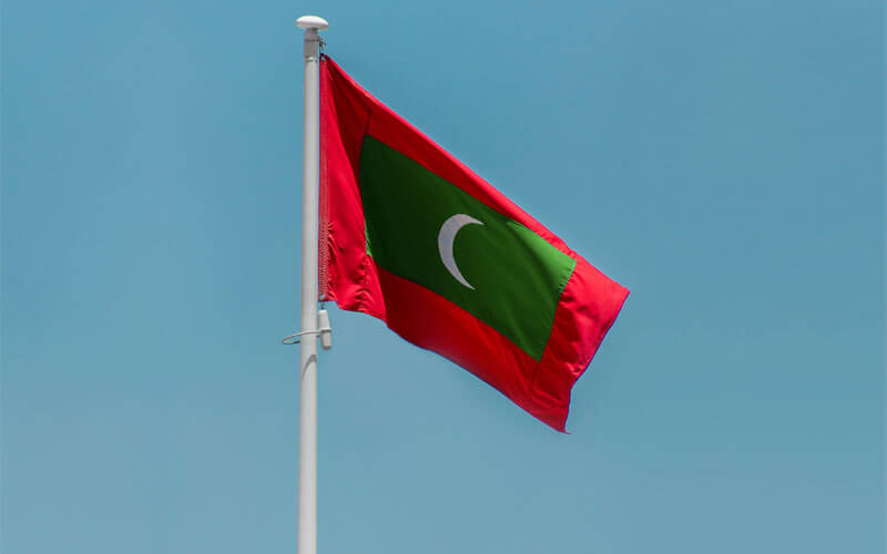 Red green flag of Maldives waving in the wind