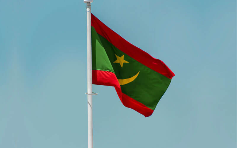 Red green flag of Mauritania flying in the wind