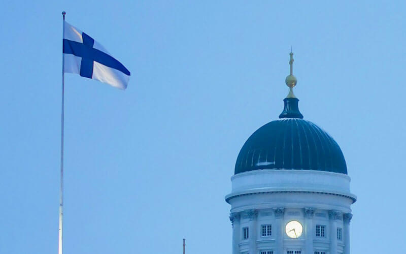 White blue Finland flag at the white blue building