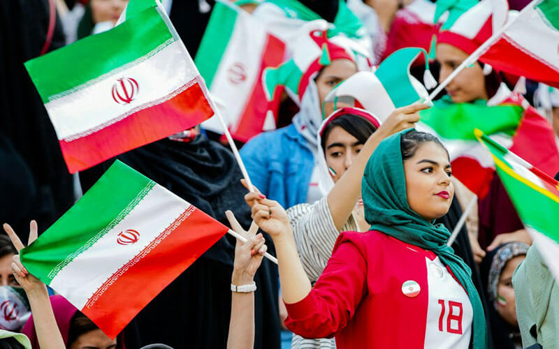 Women Cheering while Holding Mini Iranian Flag